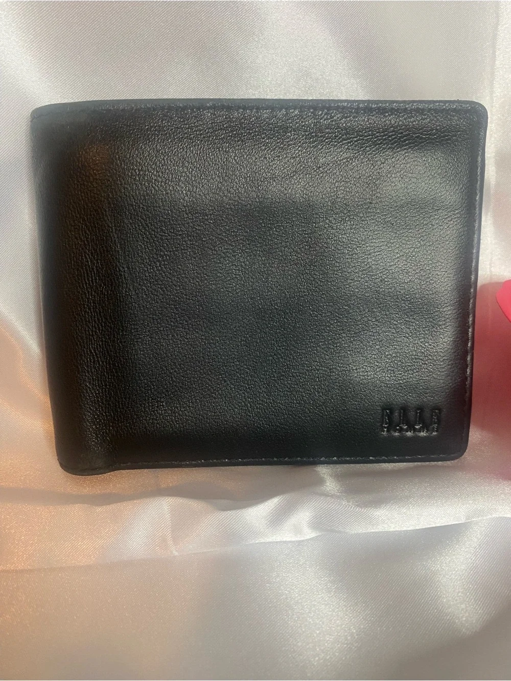 Classic Black Leather Bi-Fold Wallet with Subtle Embossed Logo
